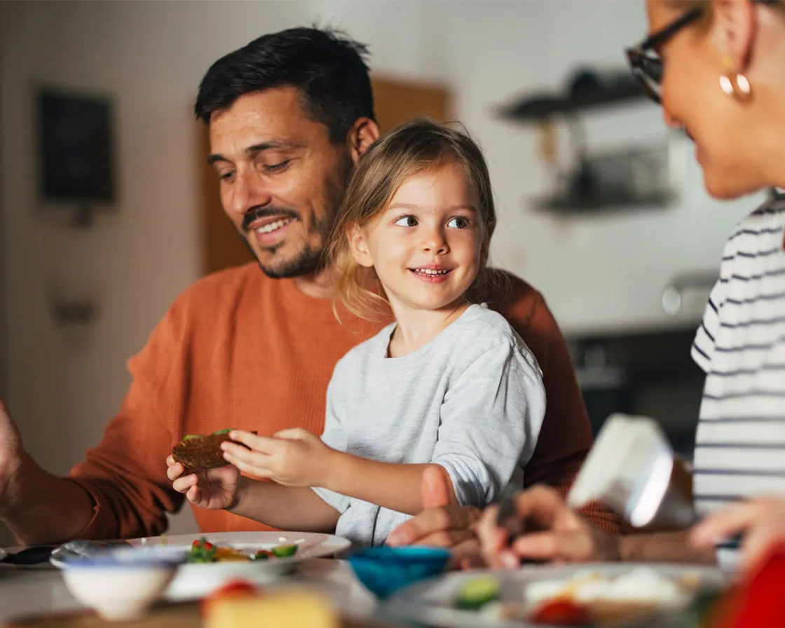 Parents with their kids at home, warm light